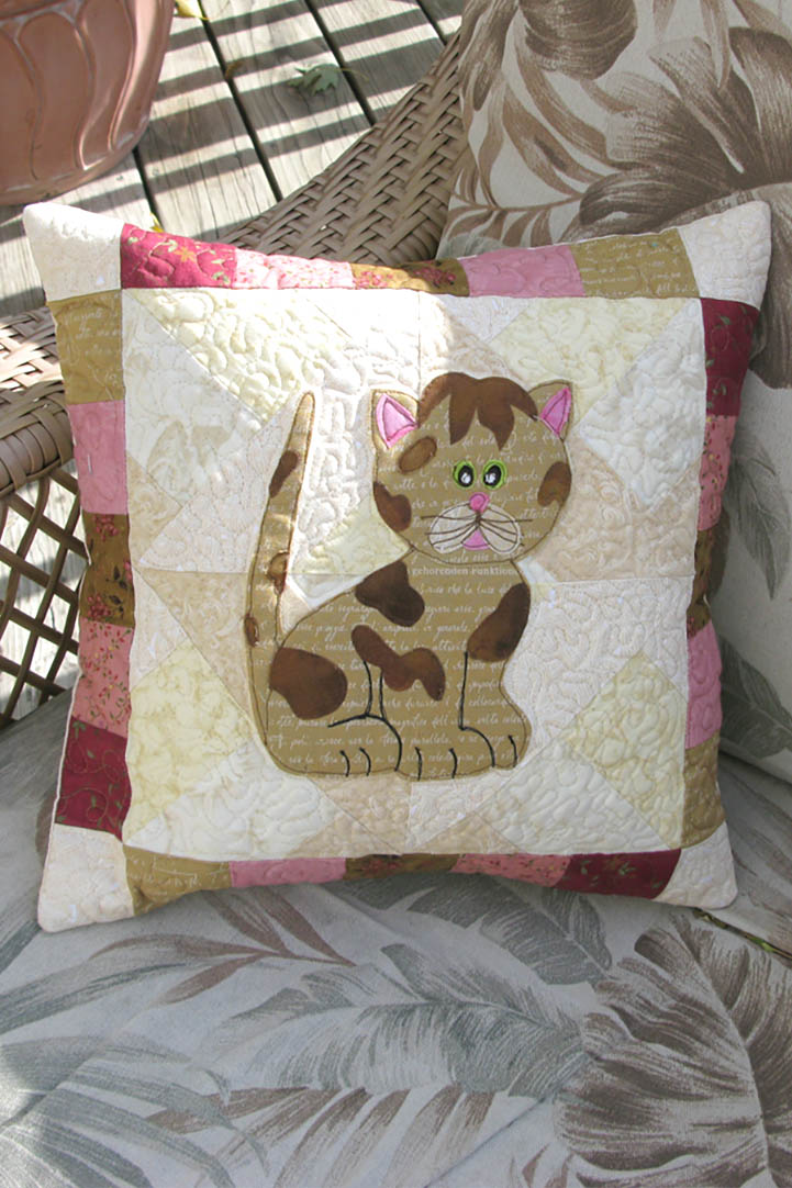 Makes a cute pillow! Kitty Kitty a cute applique quilt pattern, that has full size applique templates and full color diagrams to walk you through each step of the quilt.