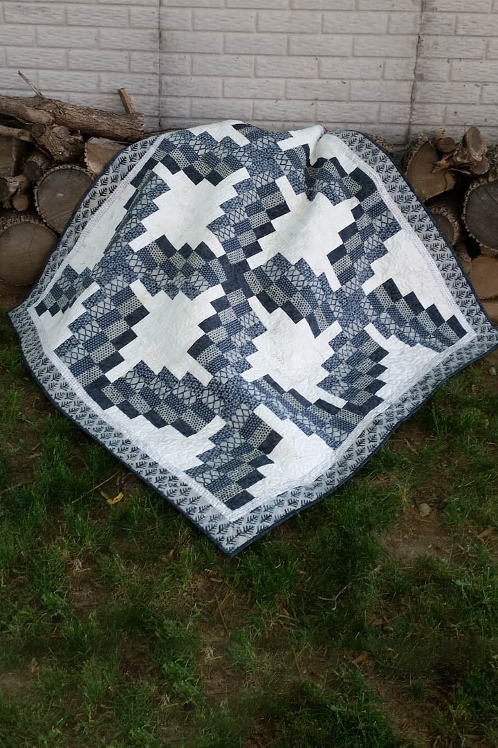 Swirly quilt pattern can be made in just one day! It uses 5 coordinating fabrics and a neutral.