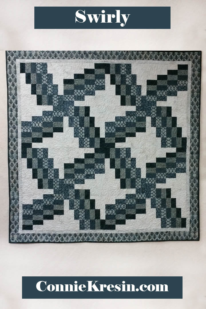 Swirly quilt pattern can be made in just one day! It uses 5 coordinating fabrics and a neutral.