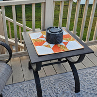Orange Fall Four Patch Table Topper on deck