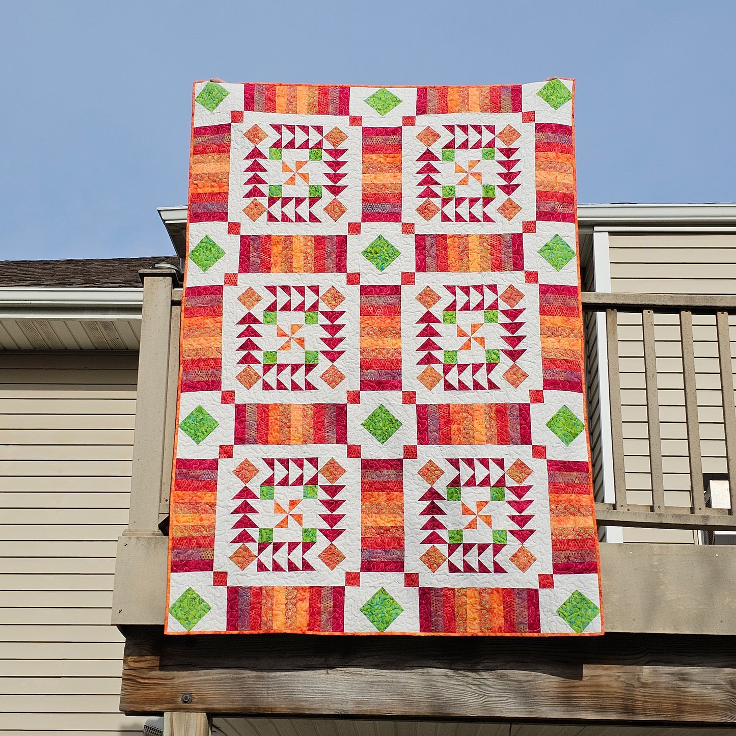 Vintage Flair quilt in orang and green batiks