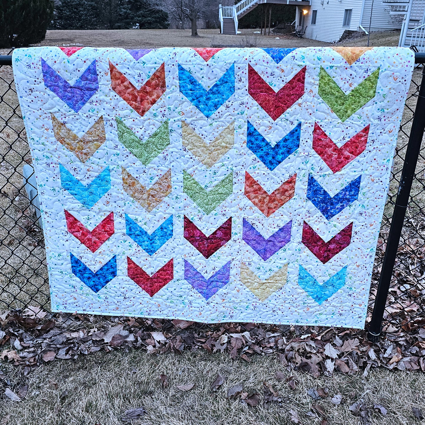 Colorful quilt pattern with a arrow design