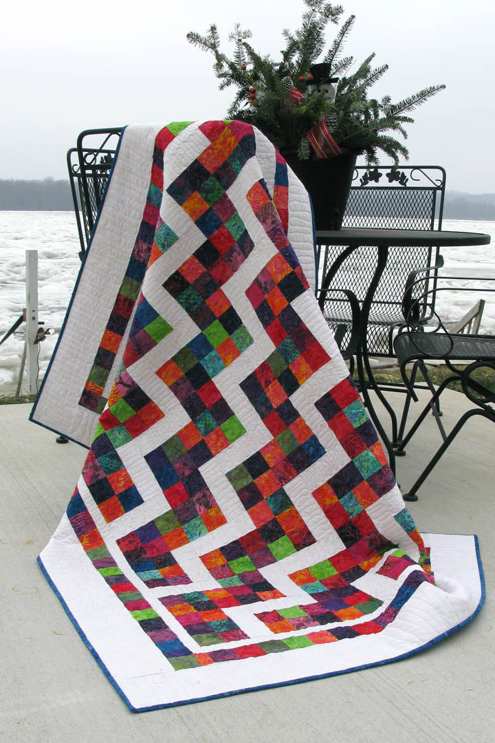 This is a fast and easy quilt pattern that you will have fun making. Confetti Steps uses one strip set, jelly roll or scraps from your stash to make a colorful quilt.