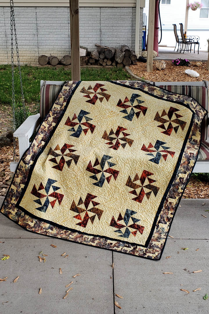 Crystals Swirls is a fast and easy quilt pattern that uses just one simple block set on point, on a swing