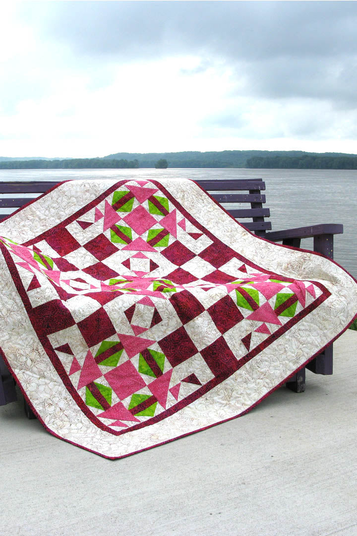 The quilt pattern uses two different blocks and one of them has a section that is done with either templates (included in the pattern) or by paper piecing with foundation paper.