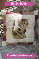 Kitty Kitty a cute applique quilt pattern, that has full size applique templates and full color diagrams to walk you through each step of the quilt.  Can also be made into a pillow