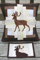 Applique deer on a log cabin block pillow that is 16 x 16 and a mug rug