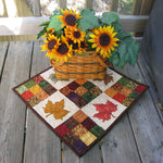 Modern Nine Patch quilt pattern with maple leaf applique