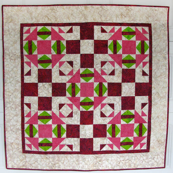 The quilt pattern uses two different blocks and one of them has a section that is done with either templates (included in the pattern) or by paper piecing with foundation paper.