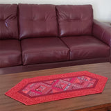 Red string table runner by couch