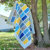 Sparkles quilt pattern in blue and yellow batiks