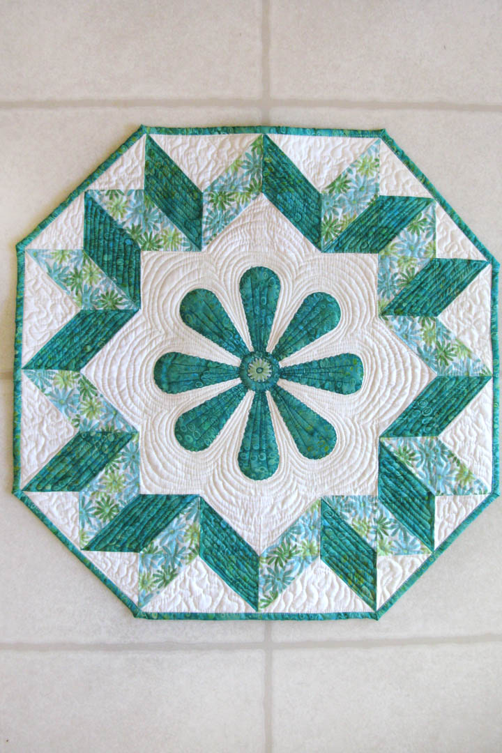 Spin the Wheel quilted wall hanging pattern with applique in the center easy to make