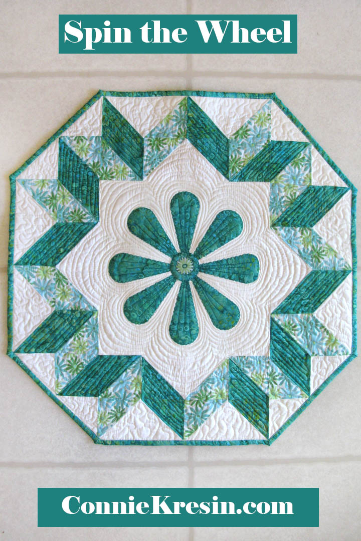 Spin the Wheel quilted wall hanging pattern with applique in the center easy to make