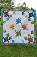 Crystals Swirls is a beautiful quilt made with just one simple block made in two different sizes.