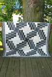 Swirly quilt pattern can be made in just one day! It uses 5 coordinating fabrics and a neutral.
