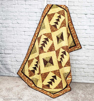 Tassel quilt on ladder by brick wall quilt pattern